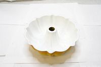 Top view of the vintage fluted enamel cake pan showing white interior and central tube.