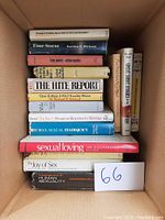 A photo showing a stack of 11 hardcover books on topics including psychotherapy, sexual health, marriage, and fiction