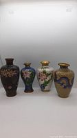 All four vases front view on white background