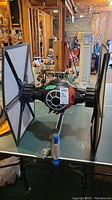 Front view of the Star Wars TIE Fighter model highlighting cockpit and wings.