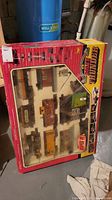 Photo of boxed Rollin Thunder vintage train set with clear viewing window showing trains and accessories inside.