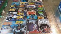 Full view of 28 assorted Heavy Metal magazines laid out in rows showing colorful fantasy and sci-fi covers.