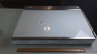 Full view of Picker X-ray box showing white illuminated flat surface, metal sides, ventilation slots, and ruler for size reference.