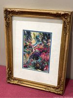 Print of "Earth Garden" by Linda Frimer in an ornate gold frame, showing visible wear and needing reframing.