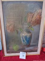 Frontal view of framed wall art painting showing vase with flowers and green apple in soft colors.