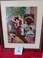Photo showing the full framed wall art with people dancing and playing music painting.