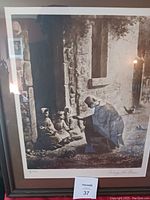 Front view of framed antique print showing the entire scene including the lady, two children, and background details.