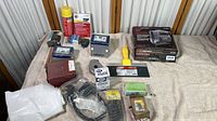 Image showing Craftsman Sabre Saw in original box with blade and instructions plus assorted hardware and tools spread on table