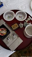 Photo showing the full lot contents including Herend bowls, glass salt & pepper, pill boxes, paperweight, and trays