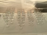 Wide view of all glassware pieces arranged by size on a tabletop