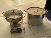 Photo of large soup pot and stainless steel fondue set with burner and fuel tablets