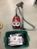 Full lot arrangement with vacuum, hose, wand, floor head and box of accessories