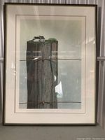 Full view of the framed signed art print showing house on wood post and rusty barbed wire.
