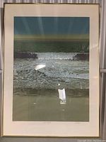 Front view of framed seascape print with white mat and thin gold-tone frame