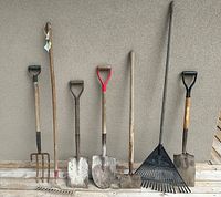 Full view of six gardening tools arranged side-by-side showing condition and type