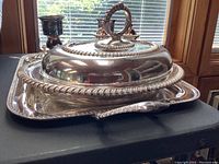 Full view of tray with covered dish, candlesticks, and condiment set