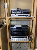 Overall view of six stacked electronics on shelving