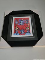 Framed and matted art print by Christian Morriseau titled 'Butterfly Family' shown from a front angle with protective corner covers.