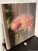 Side angle view showing the depth and resin gloss on the flower image and wood board.