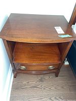 Night stand showing wood finish, shelf, drawer, and original brass hardware
