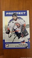 Front side of Claude Giroux autographed hockey card showing player image and signature.