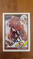 Front view of Doug Gilmour autographed hockey card in Calgary Flames uniform