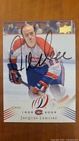 Front of the Jacques Lemaire signed hockey card showing player image, autograph, Canadiens centennial logo