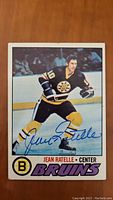 Front of Jean Ratelle hockey card showing image and autograph.