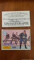 Photo of the signed Marcel Pronovost 1966-67 Topps hockey card with Certificate of Authenticity.