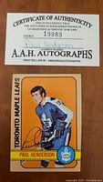 Front of Paul Henderson hockey card showing autograph and player image in Toronto Maple Leafs uniform