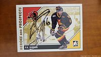 Front of an autographed P.K. Subban hockey card showing action photo with signature on card.