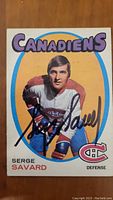 Front of vintage Serge Savard hockey card with player image and autograph