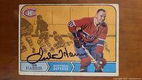 Front of hockey card showing Ted Harris in Canadiens uniform with autograph across the front.