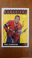 Front side of Yvan Cournoyer hockey card showing the player in Montreal Canadiens uniform with facsimile autograph and card branding.