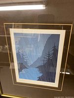 Framed 'Steelhead' print shown full view under lighting reflections