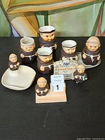Full set of W. Goebel Friar Tuck porcelain decorations including multiple figurines, a perpetual calendar, small dish, and original box.
