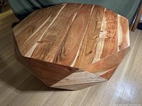 Top-down view of full table showing polygonal shape and wood grain