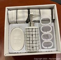 Boxed 5 piece bath set showing shower curtain, ceramic soap dispenser, ceramic soap dish and 12 plastic rings