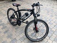 Front-side view of black Epikgo bike showing frame, handlebars, saddle and battery pack