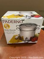 Box front showing Paderno branding and set contents with pasta, garlic, and tomato photography