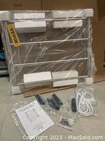 Vevor 4-bar heated towel rack in packaging, visible power cord, assembly hardware, and manual.