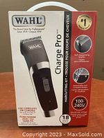 Box front view showing WAHL Charge Pro clipper image and key features including cordless and corded use, self-sharpening blades, worldwide voltage, and 18 piece kit.