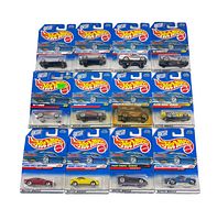 Photo showing 14 Hot Wheels cars in original packaging, titles visible including '87 T-Bird, Velocitor, Circus on Wheels, First Editions series, and others.