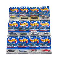 14 Hot Wheels cars in original packaging arranged in three rows showing front side of cards and vehicles.