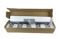 Overview photo of boxed modern bathroom vanity light wrapped in protective plastic and foam inside cardboard box.