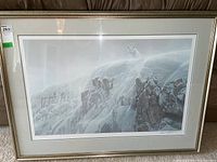 Full view of framed Robert Bateman Arctic Wolf print hanging on wall