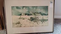 Framed watercolour painting showing the entire winter scene with farmhouse, wagon, and trees.