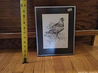 Full view of framed artwork with measuring tape showing height about 13 inches.