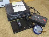 Lot overview showing the Onkyo turntable with instruction manual, Sony Blu-ray player with remote, Philips portable CD player, and Cyber Power power supply unit.