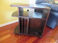 Side angle view of the wood end table showing shelving and vertical slats on one side